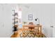 Well-lit office space with a wooden desk, stylish bookshelf, and modern decor at 3110 N Franklin St, Denver, CO 80205