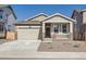Charming single-Gathering home featuring stone accents, an attached garage, and a well-manicured front yard at 917 W Beverly St, Elizabeth, CO 80107