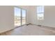 Bright living room with hardwood floors and sliding glass door leading to a balcony at 917 W Beverly St, Elizabeth, CO 80107