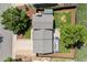 Aerial view of a well-maintained property, surrounded by lush greenery and a neatly landscaped yard at 1153 S Biscay St, Aurora, CO 80017