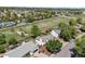 Aerial view showcasing the property's location within a tree-lined neighborhood and spacious surroundings at 1153 S Biscay St, Aurora, CO 80017