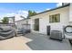Back patio area showcasing the home's exterior, access to the deck, and backyard features at 1153 S Biscay St, Aurora, CO 80017