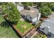 Aerial view displays the fenced backyard, mature tree, patio, and storage shed at 1153 S Biscay St, Aurora, CO 80017