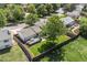 Aerial view of a home showcasing a well-manicured lawn, deck, and privacy fence at 1153 S Biscay St, Aurora, CO 80017