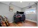 Bedroom with hardwood floors and large desk for entertainment or office use at 1153 S Biscay St, Aurora, CO 80017