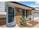 Charming brick facade with a welcoming front door and meticulously landscaped garden beds at 1153 S Biscay St, Aurora, CO 80017