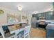 Updated eat in kitchen with stainless steel appliances and updated cabinets at 1153 S Biscay St, Aurora, CO 80017