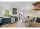 Eat in kitchen with tile floors, green cabinets, stainless appliances, and bright lighting at 1153 S Biscay St, Aurora, CO 80017
