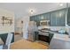Updated eat in kitchen with stainless steel appliances and updated cabinets at 1153 S Biscay St, Aurora, CO 80017