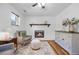 Living room featuring a fireplace, wood floors, and comfortable seating area at 1153 S Biscay St, Aurora, CO 80017
