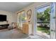 Inviting living room featuring a cozy chair, a window, and stylish decor at 1153 S Biscay St, Aurora, CO 80017
