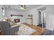 Bright living room with fireplace, wood floors, and comfortable seating area at 1153 S Biscay St, Aurora, CO 80017