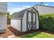 Backyard shed with double doors, offering extra storage space and charming curb appeal at 1153 S Biscay St, Aurora, CO 80017