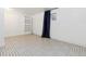Clean and simple basement space featuring neutral flooring, ample lighting, and built-in shelving at 21 Birdie Ln, Littleton, CO 80123