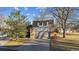 Well-maintained home featuring a two-car garage and a landscaped front yard at 21 Birdie Ln, Littleton, CO 80123