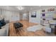 Modern living room with hardwood floors, a stylish coffee table, and ample natural light at 21 Birdie Ln, Littleton, CO 80123