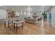 Open-concept living room featuring a fireplace, modern decor, and hardwood floors at 21 Birdie Ln, Littleton, CO 80123