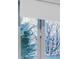 Window with white trim and view of tall winter trees at 21 Birdie Ln, Littleton, CO 80123