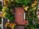 Aerial view of the home highlighting its roof, landscaping, and proximity to neighborhood trees and streets at 250 S Dahlia St, Denver, CO 80246