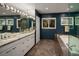 Luxurious bathroom featuring double sinks, a tub, and elegant tiling at 250 S Dahlia St, Denver, CO 80246