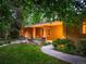Inviting exterior featuring landscaped grounds, and warm lighting at 250 S Dahlia St, Denver, CO 80246