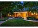 Charming home exterior with a welcoming entrance, warm lighting, and landscaping at 250 S Dahlia St, Denver, CO 80246