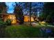 Exterior view of a home with landscaped yard, and a warm inviting ambiance at 250 S Dahlia St, Denver, CO 80246