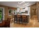 Bright, modern kitchen with white cabinets, hardwood floors, skylights, and breakfast bar seating at 250 S Dahlia St, Denver, CO 80246
