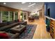Open-concept area features a large sectional, wood floors, dining area, and access to the yard at 250 S Dahlia St, Denver, CO 80246