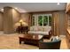 Comfortable living room with natural light, hardwood floors, and a view to the yard at 250 S Dahlia St, Denver, CO 80246