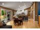 Sun-filled living area combines dining and kitchen spaces with skylights and access to the patio at 250 S Dahlia St, Denver, CO 80246