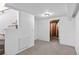 Spacious carpeted basement with bright white walls and doorway to another part of the basement at 2738 Xanadu St, Aurora, CO 80011