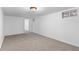 Large basement featuring carpeted floor, white walls and ceiling with a light fixture in the center at 2738 Xanadu St, Aurora, CO 80011