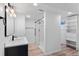 Contemporary bathroom featuring a glass shower, modern vanity and built in shelving at 2738 Xanadu St, Aurora, CO 80011