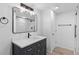 Stylish bathroom showcasing a new vanity, modern mirror and a glass walk-in shower at 2738 Xanadu St, Aurora, CO 80011