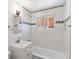 Clean bathroom featuring subway tile, a soaking tub and new fixtures and lighting at 2738 Xanadu St, Aurora, CO 80011