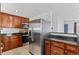 Modern kitchen with stainless steel appliances, dark countertops, and seamless access to living areas at 2738 Xanadu St, Aurora, CO 80011