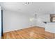 Hardwood floors and white walls create a bright, open living space with recessed lighting at 2738 Xanadu St, Aurora, CO 80011