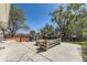 Backyard with a deck, fire pit, and stone seating area perfect for entertaining at 8258 Cherokee St, Denver, CO 80221
