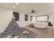 Finished basement featuring a theater area, stylish seating, and creative decor at 8258 Cherokee St, Denver, CO 80221