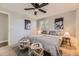 Cozy bedroom features gray walls, patterned rug, and decoratively styled bed at 8258 Cherokee St, Denver, CO 80221