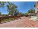 Large wooden deck overlooks manicured yard for relaxation and entertainment at 8258 Cherokee St, Denver, CO 80221
