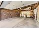 Spacious two car garage has brick wall and workbench with lots of storage at 8258 Cherokee St, Denver, CO 80221
