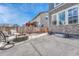 Backyard patio with fire pit and comfortable seating, perfect for outdoor gatherings and relaxation at 1066 S Eaton Park Ct, Aurora, CO 80018