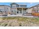 This backyard has a patio, stairs, a hot tub, and is ready for outdoor gatherings and relaxation at 1066 S Eaton Park Ct, Aurora, CO 80018
