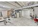 Unfinished basement with exposed ceiling and utilities ready for customization and ample storage at 1066 S Eaton Park Ct, Aurora, CO 80018
