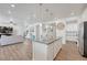 Spacious kitchen features a large island and an open floor plan, perfect for entertaining at 1066 S Eaton Park Ct, Aurora, CO 80018