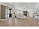 Bright living room with a sliding glass door to the patio, hardwood floors, a fireplace and a large TV at 1066 S Eaton Park Ct, Aurora, CO 80018
