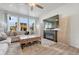Bright living room with large windows, a modern fireplace, and plush seating for relaxation at 1066 S Eaton Park Ct, Aurora, CO 80018
