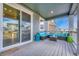 Covered patio area featuring comfortable outdoor seating, perfect for relaxation and entertainment at 1066 S Eaton Park Ct, Aurora, CO 80018